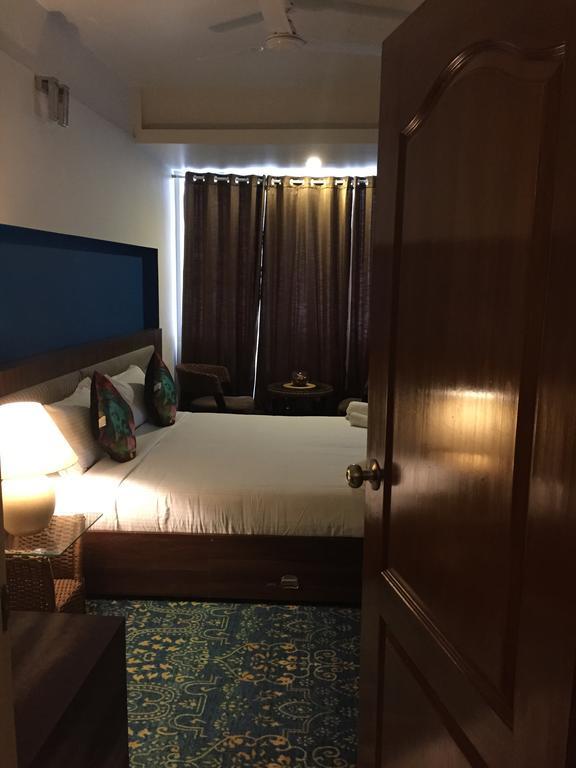 Luxtay Suites Bangalore Ruang foto